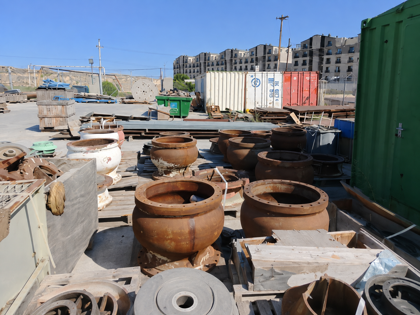 Industrial solid metal parts arranged in a material yard